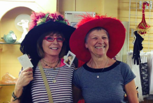 Kathy (left) Antonelli and Jan Couper checking out hats